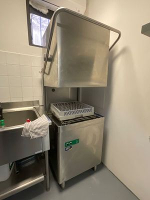 a kitchen with a sink and a dishwasher in it