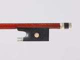 a close up of a violin bow on a white background
