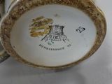 a close up of a cup and saucer on a table