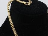 a close up of a necklace on a mannequin mannequin