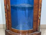 a glass display cabinet with a blue glass door