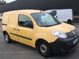 a small yellow van parked in a parking lot