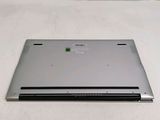 a laptop that is sitting on a white surface