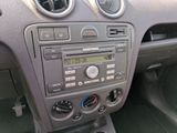 a car dashboard with a clock and radio in it