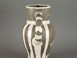 a vase that has a picture of a man on it