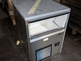 a refrigerator that is sitting in the middle of a room
