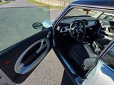 a car with its door open on the street