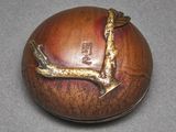 an image of a wooden box with a bird on it