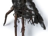 a sculpture of a man made out of twigs on a white surface