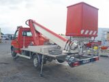 a red truck with a crane on the back of it