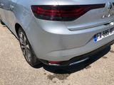 a silver car parked on the side of the road
