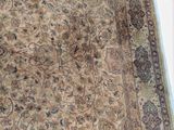 a large rug with a brown and blue design on it