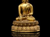 une image représentant une statue de Bouddha en or sur fond noir