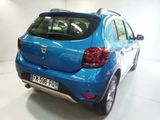 a picture of a blue car parked in a garage