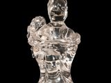 an image of a glass figurine of a woman holding a baby