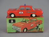 a red toy car sitting on top of a box