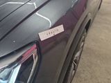 a close up of a car with a sticker on it ' s hood