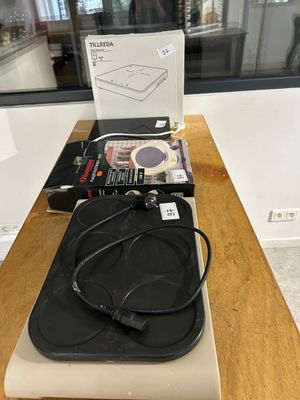 a box with a pair of headphones sitting on top of it