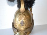 a stuffed animal that is sitting on top of a helmet