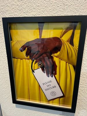 a picture of a picture of a woman holding a tag