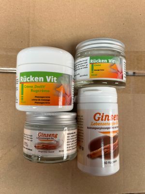 three jars of ginseng sit on a shelf next to a cardboard box