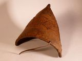 a brown hat that is on a white surface