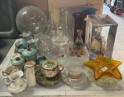 a table with a lot of glass items on it