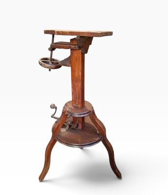 a wooden table with a metal base and a wooden top