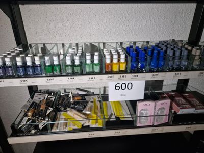 a shelf of cosmetics and other beauty products in a store
