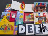 a pile of children ' s books on a table