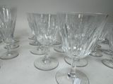 several empty wine glasses are lined up on a table