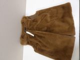 the jacket is brown in color and has a white tag on it