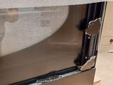 a picture of a stainless steel refrigerator with a broken glass door