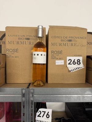 many boxes of wine on a shelf in a store