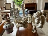 many figurines sitting on a coffee table in a living room
