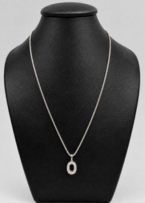 Chaîne or gris 3,7 g et pendentif or orné de petits diamants…