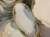 a lot of plates that are sitting on a table