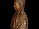 an old wooden statue of a woman with a crown on her head