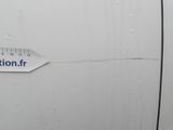 a sticker on the side of a white car