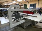 a man that is working on a machine in a factory