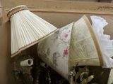 a lamp that is sitting on top of a pile of assorted items