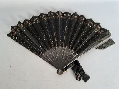a black fan that is sitting on a white table
