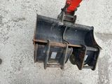 a close up of a traffic light on a concrete surface