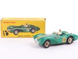 an image of a green toy car with a box in the background