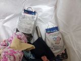 a bag of diapers, a bag of diapers, and a bag of diapers on a bed