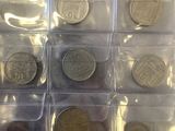 a close up of a bunch of coins in a plastic container
