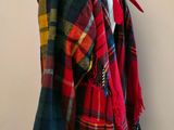 an image of a red and blue plaid coat on a mannequin