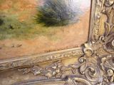 une image d'un tableau sur le mur d'une pièce
