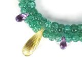 green and purple beaded bracelet with amethorate, amethorate, and amethorate beads