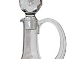 a clear glass decanter with a crystal ball on the top